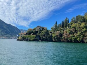 Click to enlarge Flower-filled terraced garden overlooking the blue waters of Lake Como in Italy.